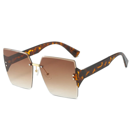 Lunettes de soleil carrées sans monture pour femme